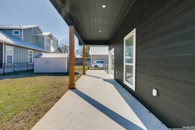 view of patio / terrace with a shed