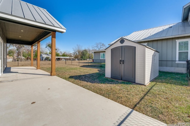 view of patio / terrace with a shed