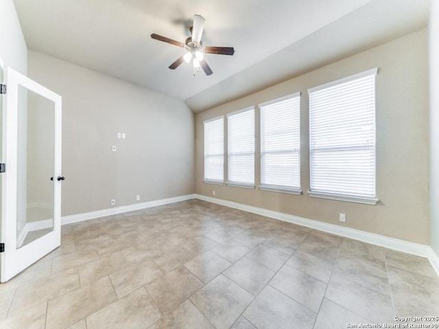 empty room with vaulted ceiling and ceiling fan