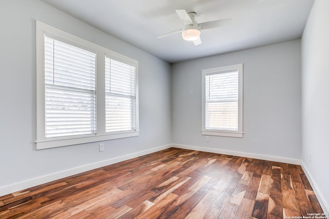 empty room featuring ceiling fan and wood-type flooring