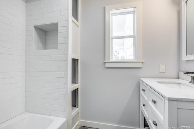 bathroom with vanity and bathing tub / shower combination