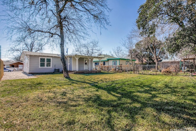 view of front facade featuring a front lawn, central AC unit, and a porch