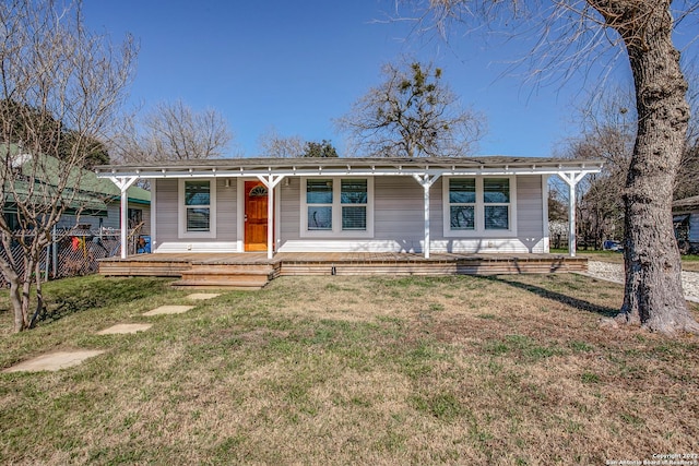 view of front facade with covered porch and a front yard