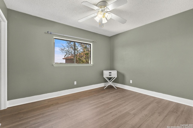 unfurnished room featuring ceiling fan, a textured ceiling, and light hardwood / wood-style flooring