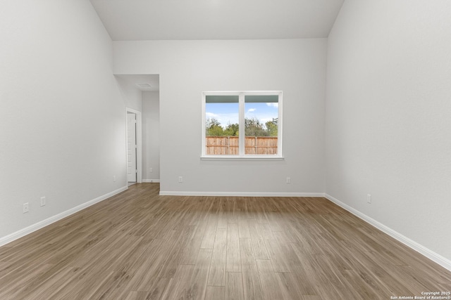 unfurnished room featuring wood-type flooring