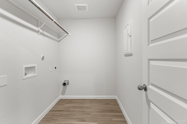 laundry room with electric dryer hookup, hookup for a gas dryer, wood-type flooring, and hookup for a washing machine