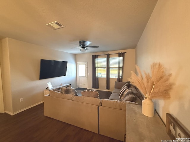 living room with dark hardwood / wood-style floors and ceiling fan