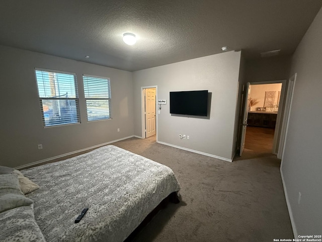 carpeted bedroom featuring a textured ceiling