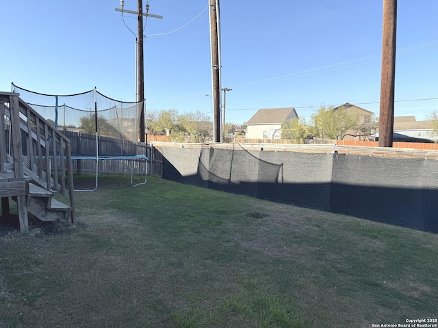 view of yard featuring a trampoline