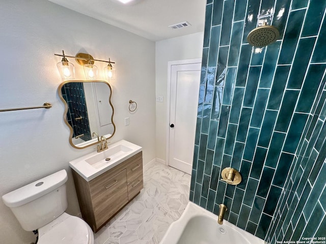 full bathroom featuring bathing tub / shower combination, vanity, and toilet