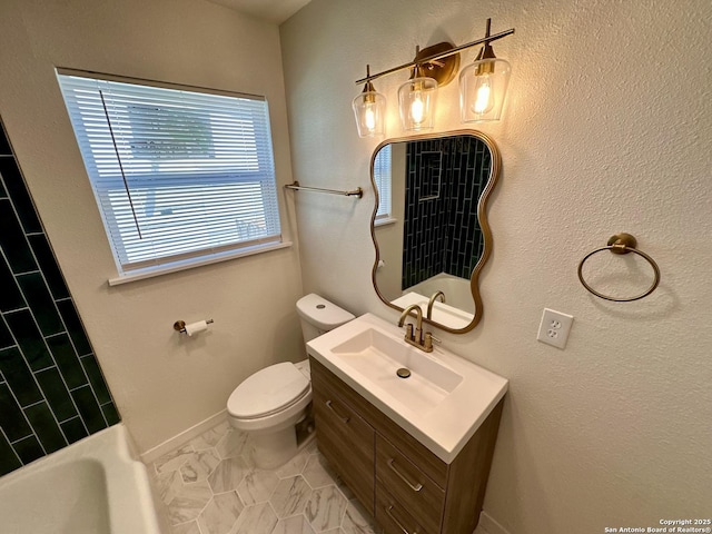 bathroom with tile patterned flooring, vanity, and toilet