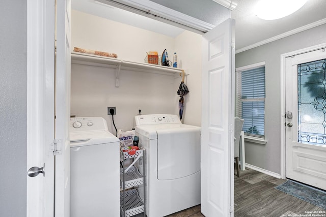 clothes washing area with dark hardwood / wood-style flooring, washer and clothes dryer, a textured ceiling, and ornamental molding