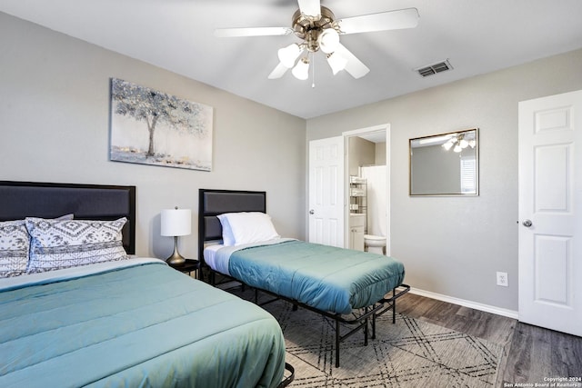 bedroom with ceiling fan, wood-type flooring, and ensuite bath