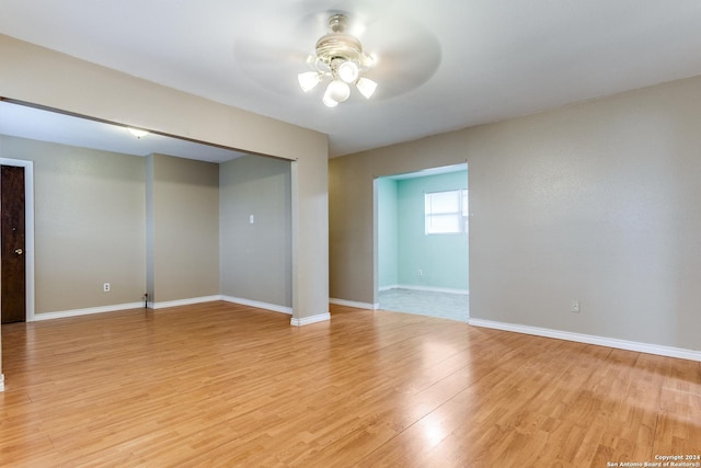 unfurnished room with ceiling fan and light hardwood / wood-style flooring