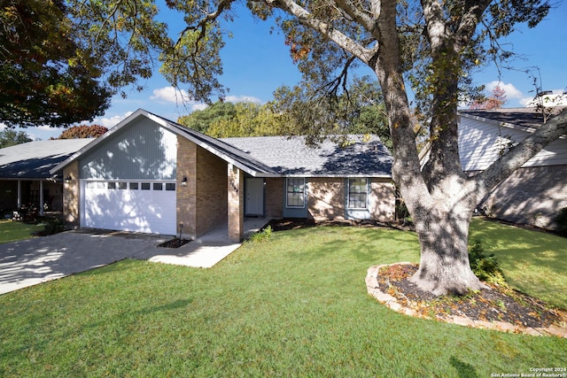 ranch-style home featuring a garage and a front lawn