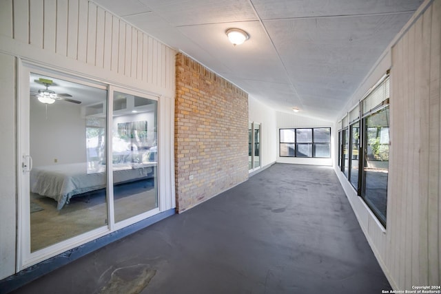 interior space with ceiling fan and lofted ceiling