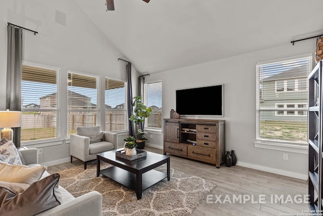 living room featuring light wood-type flooring, vaulted ceiling, and ceiling fan