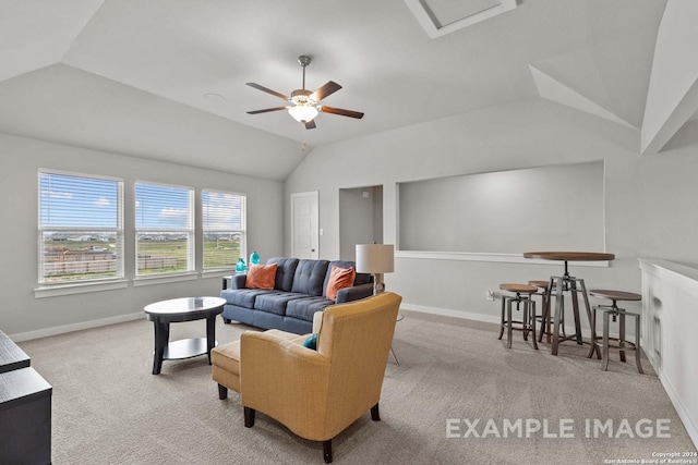 living room featuring ceiling fan, lofted ceiling, and light carpet