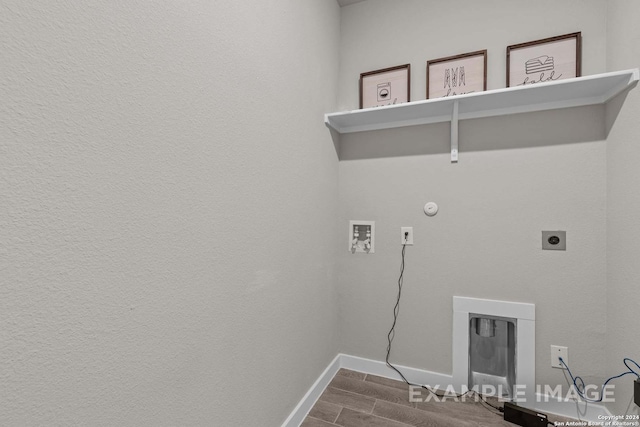 laundry area with electric dryer hookup, hookup for a gas dryer, washer hookup, and wood-type flooring