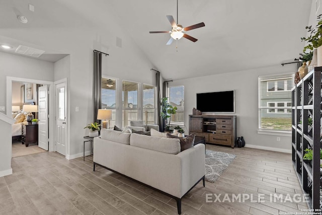 living room with high vaulted ceiling, light hardwood / wood-style flooring, and ceiling fan