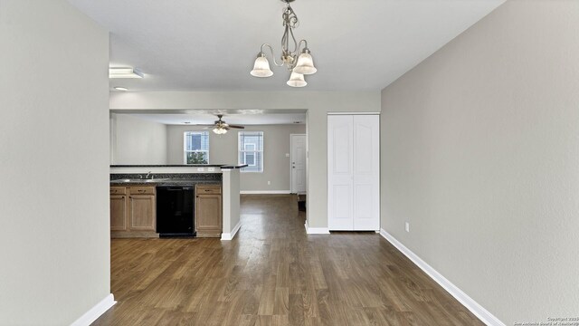 kitchen with ceiling fan with notable chandelier, sink, dark hardwood / wood-style floors, black dishwasher, and decorative light fixtures