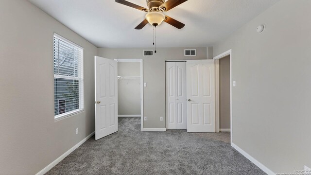 unfurnished bedroom featuring ceiling fan and light colored carpet