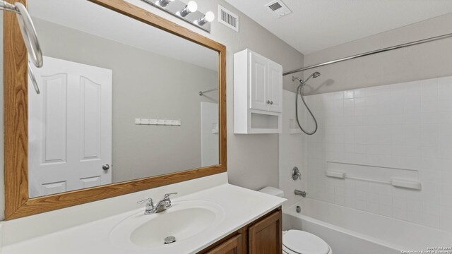 full bathroom featuring vanity, toilet, and bathtub / shower combination