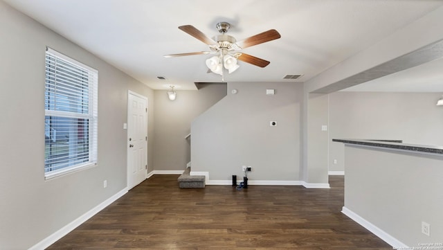 interior space with dark hardwood / wood-style floors and ceiling fan