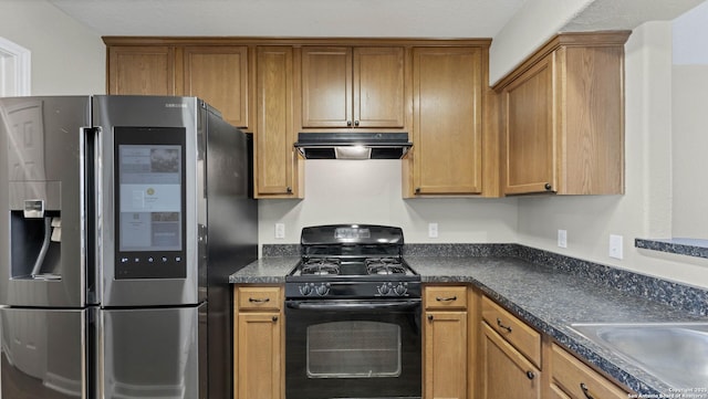 kitchen featuring black range with gas cooktop and stainless steel refrigerator with ice dispenser