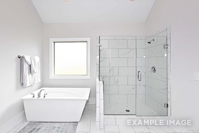 bathroom featuring separate shower and tub