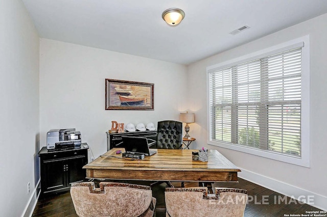 office area with plenty of natural light and dark wood-type flooring