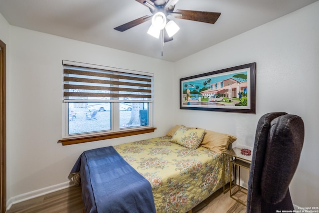 bedroom featuring hardwood / wood-style floors and ceiling fan