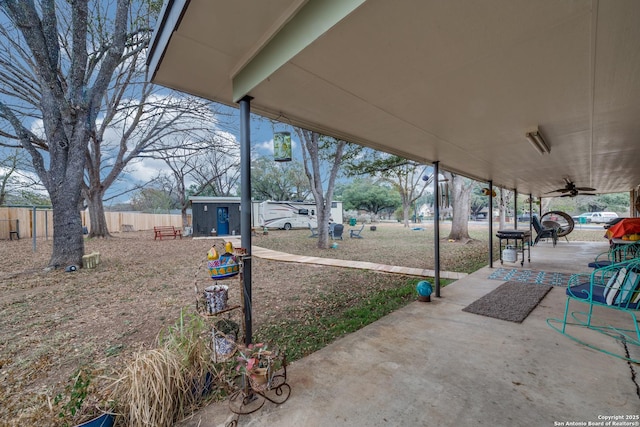 view of patio featuring a shed