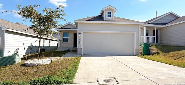 view of front of home featuring a garage and a front yard