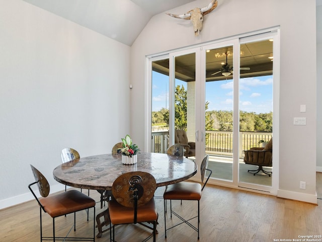 dining space featuring ceiling fan, light wood-type flooring, and a wealth of natural light