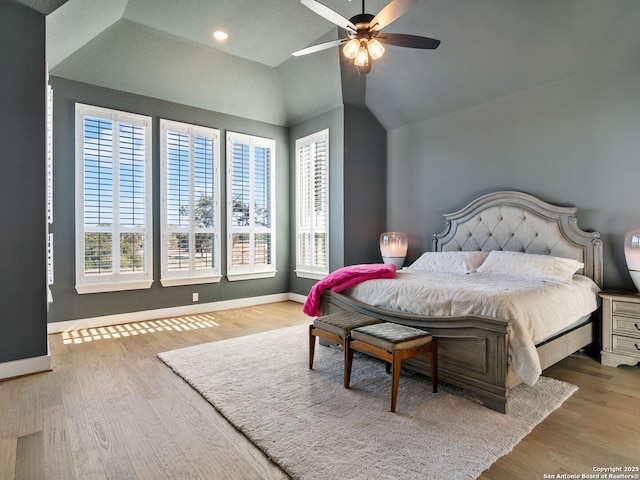 bedroom featuring vaulted ceiling, ceiling fan, and light hardwood / wood-style floors