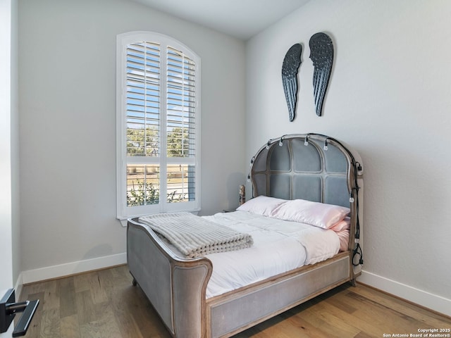 bedroom featuring wood-type flooring