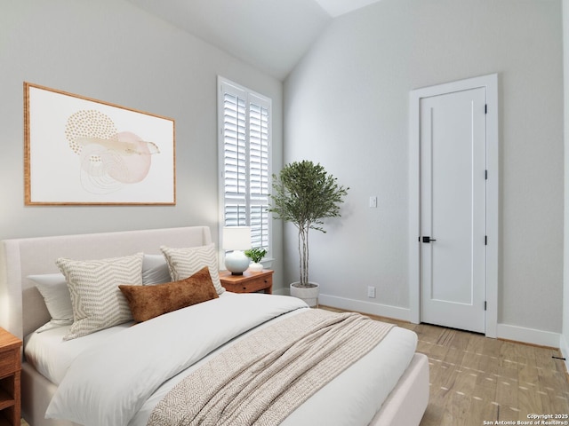 bedroom with vaulted ceiling