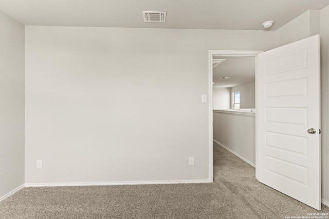 empty room with carpet flooring