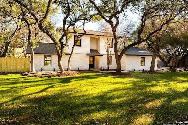 view of front of home with a front lawn