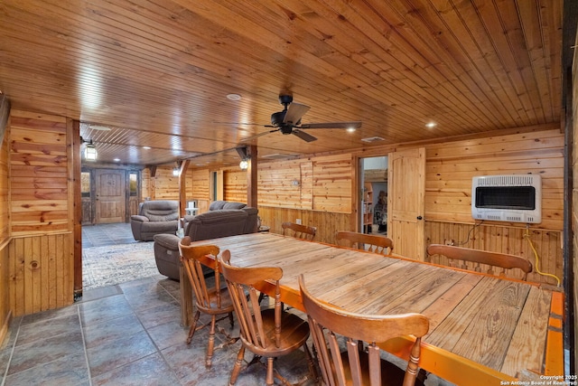 dining room with wood ceiling, heating unit, ceiling fan, wooden walls, and log walls