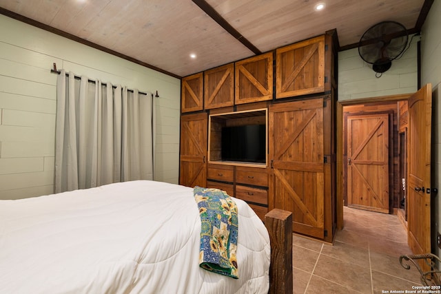 bedroom with wood walls and wood ceiling