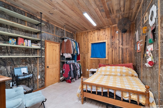 bedroom with wooden walls and wooden ceiling