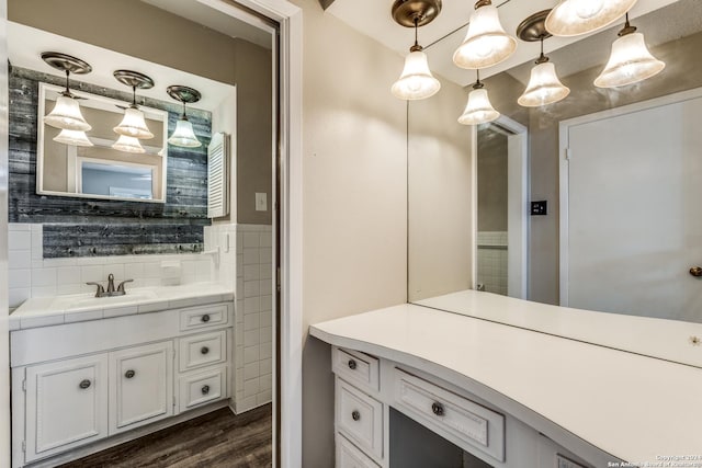 bathroom with vanity and wood-type flooring