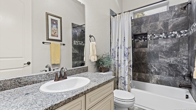 full bathroom with vanity, toilet, and shower / tub combo with curtain