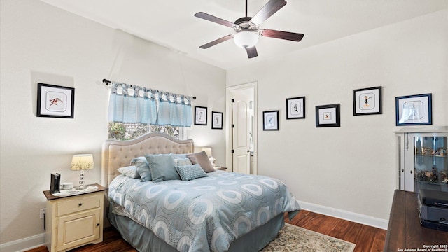 bedroom with ceiling fan and dark hardwood / wood-style flooring