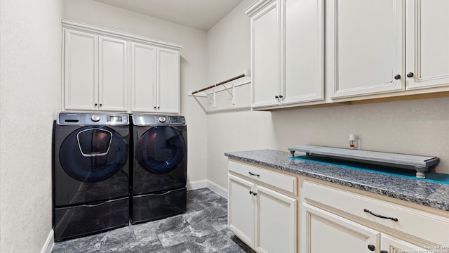 laundry area featuring cabinets and washing machine and dryer