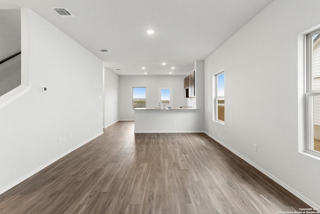 unfurnished living room featuring hardwood / wood-style floors