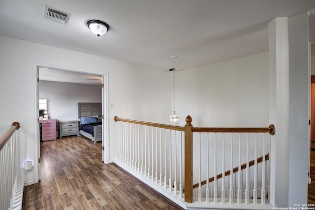 hall with hardwood / wood-style flooring