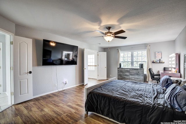 bedroom featuring hardwood / wood-style flooring and ceiling fan